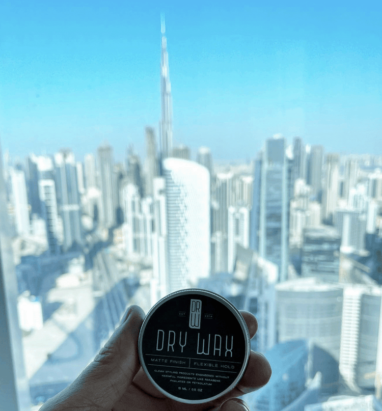 Dry Wax in front of Dubai skyline.