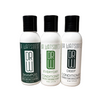 Three bottles of Dr. Watson's hair care products on a gray background